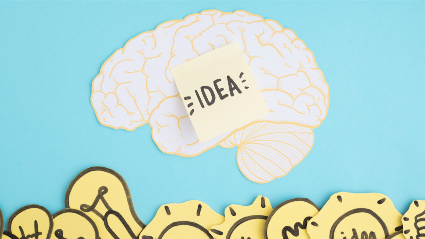 Dibujo de un cerebro con una nota que contiene el texto "idea"